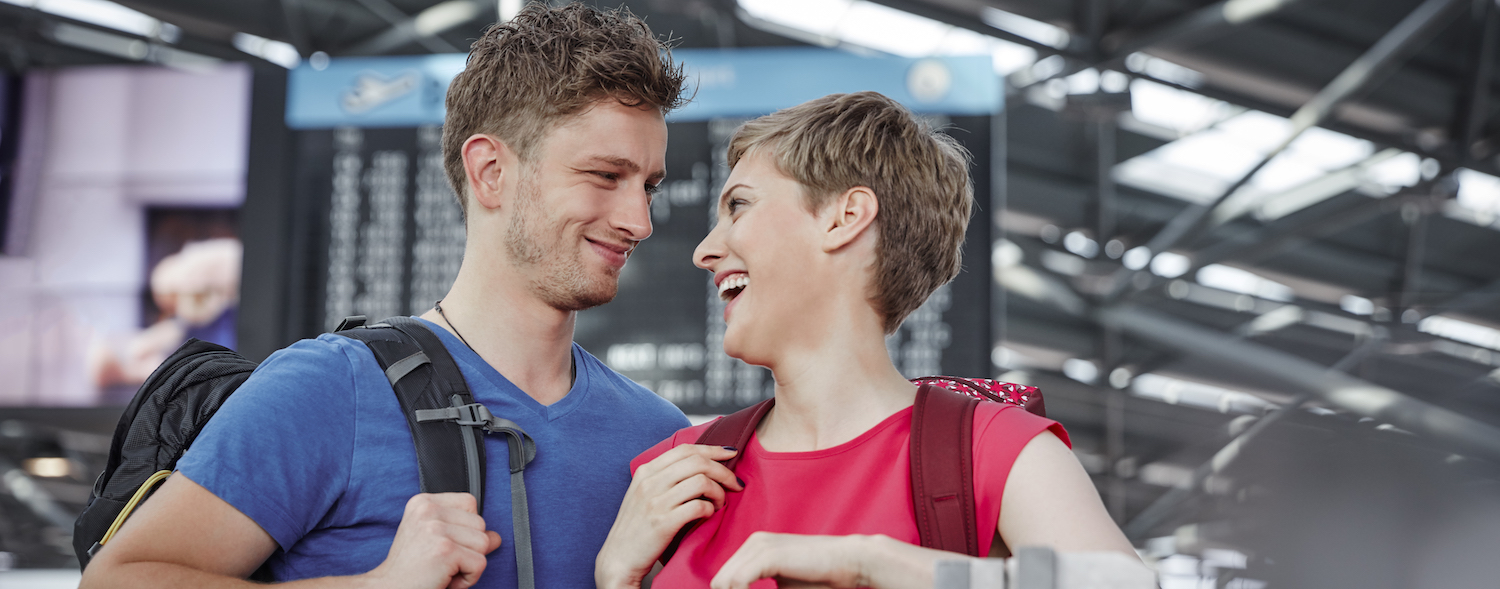 Happy couple at airport